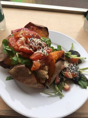 Hummus and roast tomato baked sweet potato at Larder in Brighton