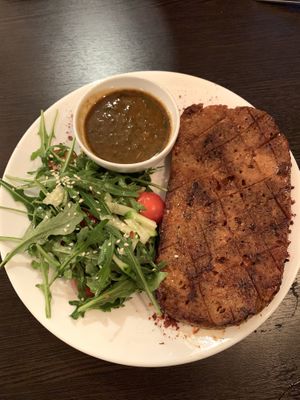 seitan steak with salad at Ugol in Moscow