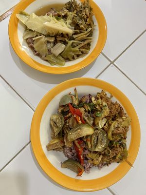 Two plates of rice and two toppings each   at Ranahat Je Vegan Restaurant in Ayutthaya
