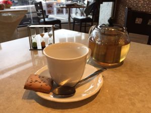 tea, vegan biscuit and tea timer... at Tiwari Tea House in Footscray