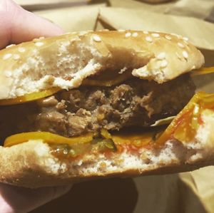 Close up of the double cheese 1/4lb burger ?  at Earth Restaurant & Takeaway in Petersfield