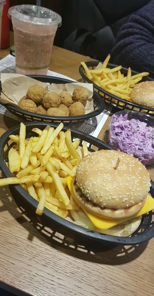 Big earth burger, fries, popcorn chicken and coleslaw at Earth Restaurant & Takeaway in Petersfield