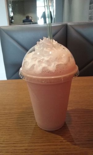 This is a small morello cherry milkshake- with whipped cream, absolutly divine!! they serve freshly squeezed lemonade, handmade soda and coke too! at Earth Restaurant & Takeaway in Petersfield