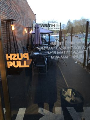 Outdoor seating area at Earth Restaurant & Takeaway in Petersfield