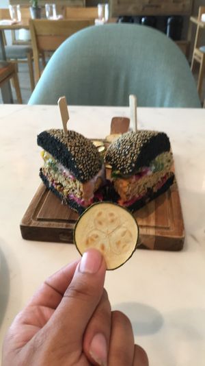 Black burger with Zucchini Chips at Plant Cafe in Hamala