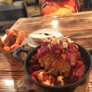Whole roasted Cauliflower main with sweet potato fries!  at Source in York