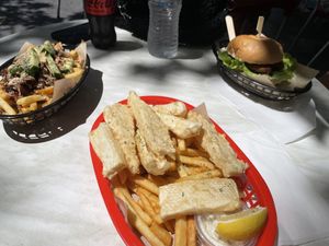 Fish burger, mushroom loaded fries and seafood basket.  at The Fish Shack in Canberra