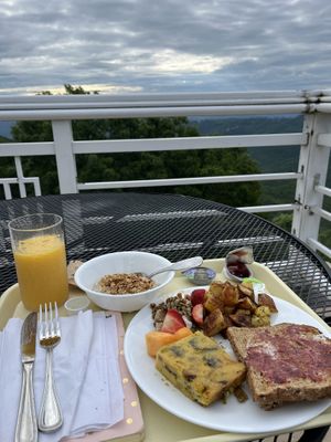Breakfast with a view! Oatmeal with granola, vegan quiche, whole grain toast, potatoes, vegan cream cheese with nuts & fruit. Soooo good!   at Art of Living Retreat Center in Boone