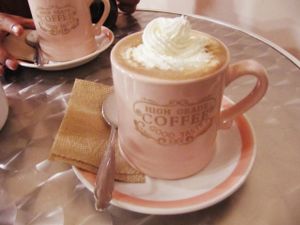 Vegan hot chocolate and whipped cream at The Churro Bar & Vegan Bakery in Cusco