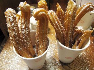 Churros con chocolate to go at The Churro Bar & Vegan Bakery in Cusco