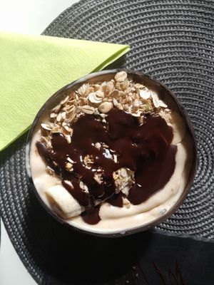 Penaut butter oatmeal. Toppings: chocolate, banana, granola at Sorrir in Wroclaw