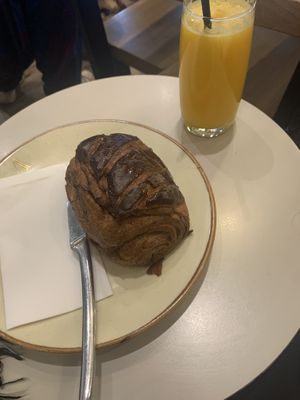 Pain au chocolat and orange juice  at Arapina in South East London