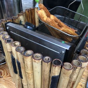 Churros in the fryer at Brazilian Churros - Food Stand in South East London