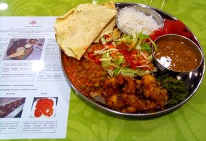 Banana Curry, lentils soup, green peas with tofu, salad with spicy sauces and breads at Cantina Indiana in Lisbon