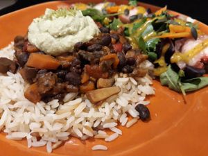 Stew beans with mushroom, aromatic rice and a cashew lime paté. Salad multicolor with a mango vinaigrette. at Bruta Flor in Lisbon