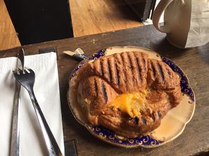 hot toasted croissant with tomato pesto and cheese at The Cran in Glasgow