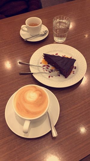 Sweet potato chocolate cake and oatmilk cappuccino  at Das Kombinat in Augsburg