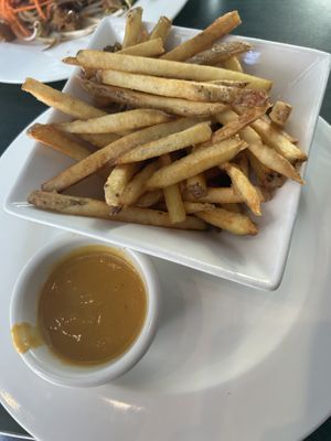 Fries with cheese dip  at Hearts Choices - NorthEast in Calgary