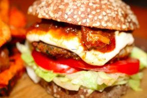 Burger - sesame seed bun, chunky tomato relish, cashew 'aioli', chickpea/lentil/brocolli pattie, lettuce & tomato at Green Wise Monkeys in Sydney
