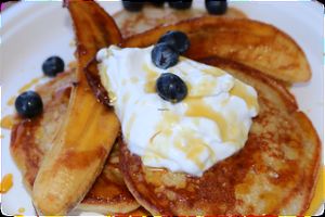 pancakes topped with coconut yoghurt, blueberries, pure maple syrup, caramelised banana  at Green Wise Monkeys in Sydney