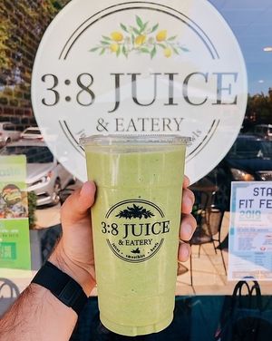 Tropical Breeze Smoothie made with fresh orange juice, coconut milk, coconut flakes, pineapple, mango, kale & your choice of yogurt. at 3:8 Juice & Eatery in Milton