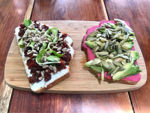 Two kinds of toast. Sun dried tomato, and beetroot hummus.  at Fresco Habito in Playa Del Carmen