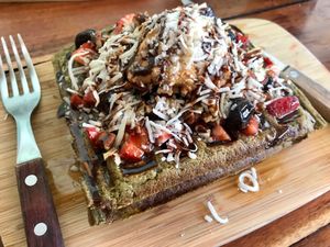 Matcha waffles with chocolate sauce and peanut butter  at Fresco Habito in Playa Del Carmen