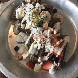 Vegan gluten free waffles with vanilla cashew cream and fresh berries at Harvest Cafe in Ventura