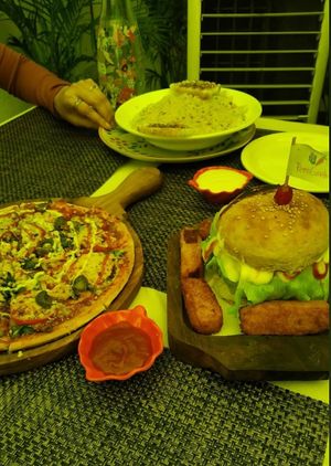 Pizza, burger with fish fingers( didn't taste like seafood ,but it is worth trying!) . Pasta was pretty good with mild flavours at Rare Earth Cafe & Organic Store in Mumbai