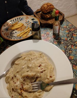 cheezy pasta and tandoori burger at Rare Earth Cafe & Organic Store in Mumbai