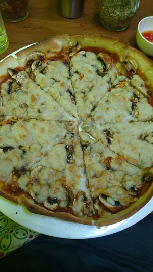 Mushroom Pizza with cashew-based vegan cheeze at Rare Earth Cafe & Organic Store in Mumbai