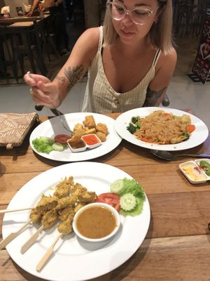Satay sticks, tofu bites and wide noodle stir fry   at Yo Vegan in Phuket