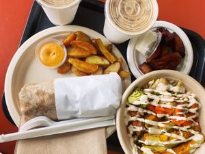 Burrito and bowl combo plate with tofu, roasted veggies and vegan cream. YUM!   at Oasis Vegetarian Cafe in Riverside
