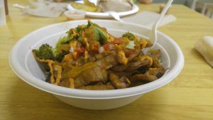 Carnitas with herb roasted veggies and red pepper sauce  at Oasis Vegetarian Cafe in Riverside