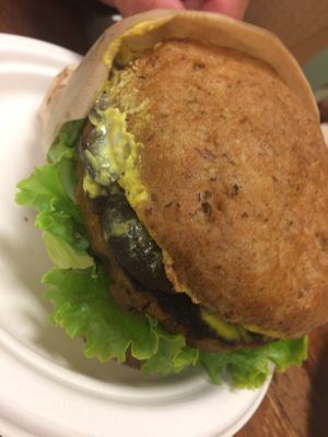 GF vegan bun with Oasis whole foods patty with turmeric aioli and mushrooms at Oasis Vegetarian Cafe in Riverside