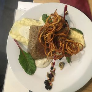 seitan steak with potatoe chips and mashed potatoes at Die Küche in Brno