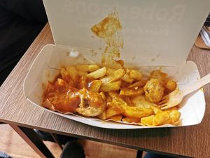 Sausage, chips and curry sauce at Robertson's Chips Away in Whitby