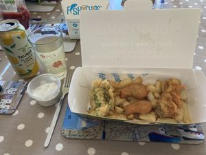 Pea fritter, nuggets, battered sausage and chips. Garlic mayo on left along with Aldi vegan lemon cider!  at Robertson's Chips Away in Whitby