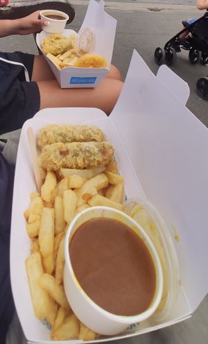Terrible photo but battered vegan sausages. at Robertson's Chips Away in Whitby