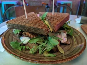 Club sandwich (mortadella, cheese, mushrooms, arugula) at Jonny Aldana in Barcelona