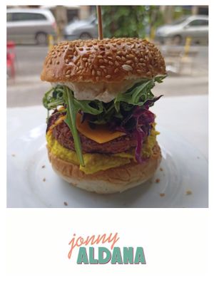 Lentils burger, turmeric humous, red cabagge, rocket, veganaise. at Jonny Aldana in Barcelona
