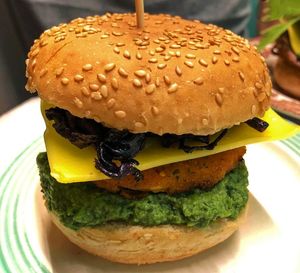 No pollo or crisp tofu, greenpea and espirulina mole, veganchiz cabbage. at Jonny Aldana in Barcelona