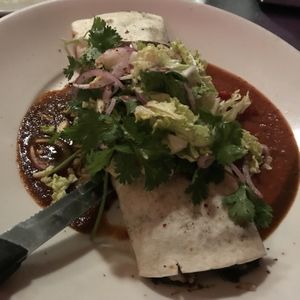 huge burrito the size of my head! called the burrito de evan. with mushrooms, vegan cheese, and skip the sour cream at Cafe Miranda in Rockland