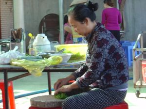 Owner making spring rolls at Com Chay in Chon Thanh