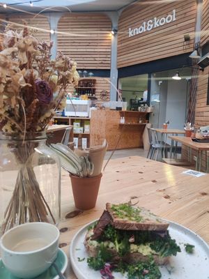 Seating area and BLT and 'egg' sandwich at Knol & Kool Bistro & Superet in Ghent