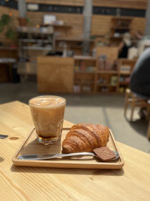Iced coffee and croissant  at Knol & Kool Bistro & Superet in Ghent