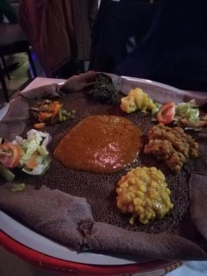 Two curries on homemade Ethiopian flatbread at Naomi Restaurant & Bar in Bergen