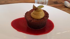 Chocolate cake with pistachio cream and red fruit coulis at Hope in Paris