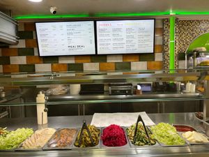 The falafel toppings are as follows: hummus, fried potatoes,  pickled red cabbage, gherkins, tomatoes & cucumbers, lettuce, tahini sauce, chilli sauce.  at Go Falafel - Deansgate in Manchester