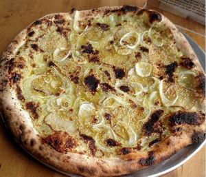 a daily special: Vegan dill béchamel base, sliced roasted red potatoes, fennel. Finished with cashew parmesan and Monte Iblei olive oil at Pompieri Pizza in Durham